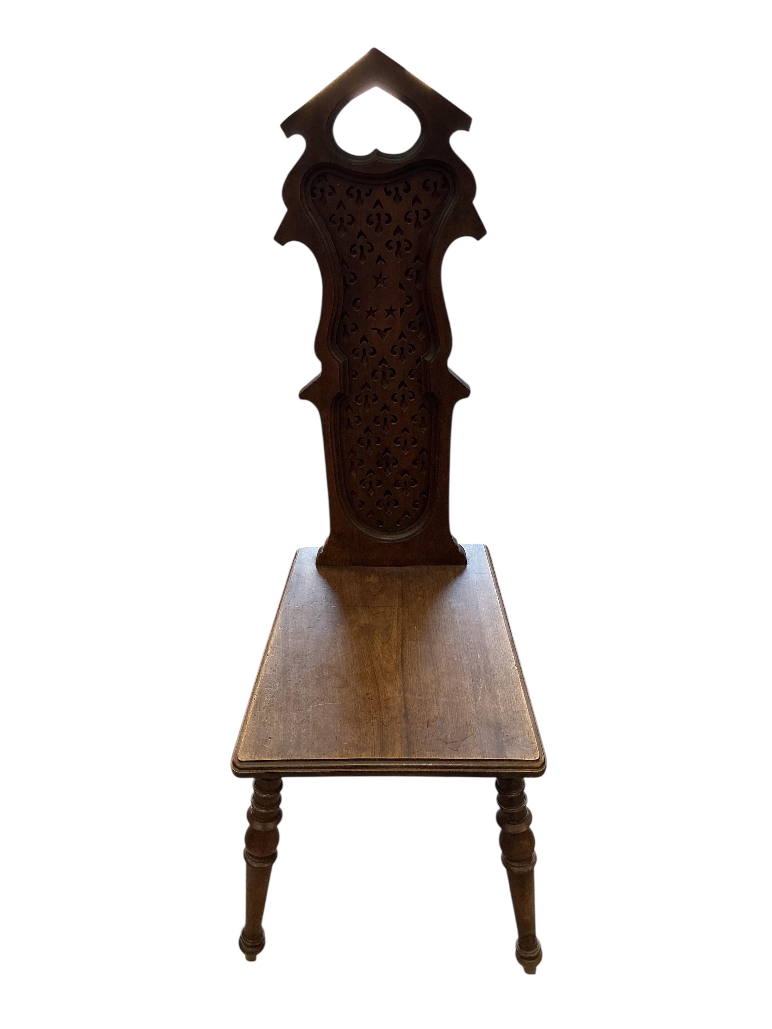 A pair of early 20th century French carved walnut hall chairs, width 36cm, depth 40cm, height 108cm